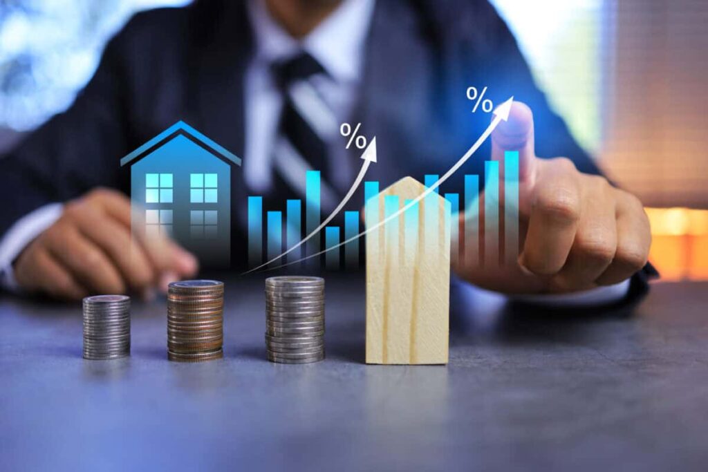 Canada’s Job Market Could Decide What Happens to Mortgage Rates Next Real estate investment concept with person pointing on growth graph and coin stacking to get profit from property