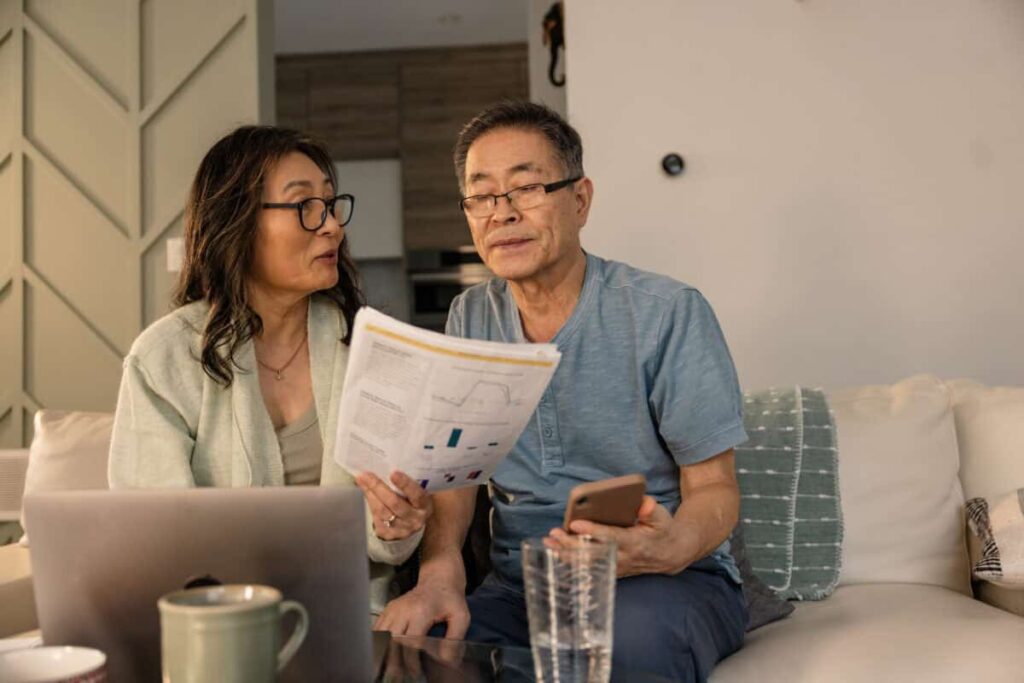 Retirement Savings Plan for Late Starters: A Realistic Roadmap senior couple looks at investing statements