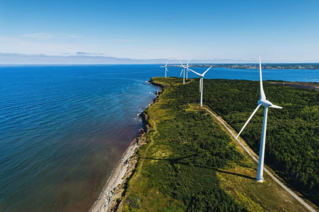 The Perfect TFSA Stock: A 3.3% Yield With Monthly Paycheques Aerial view of a wind farm